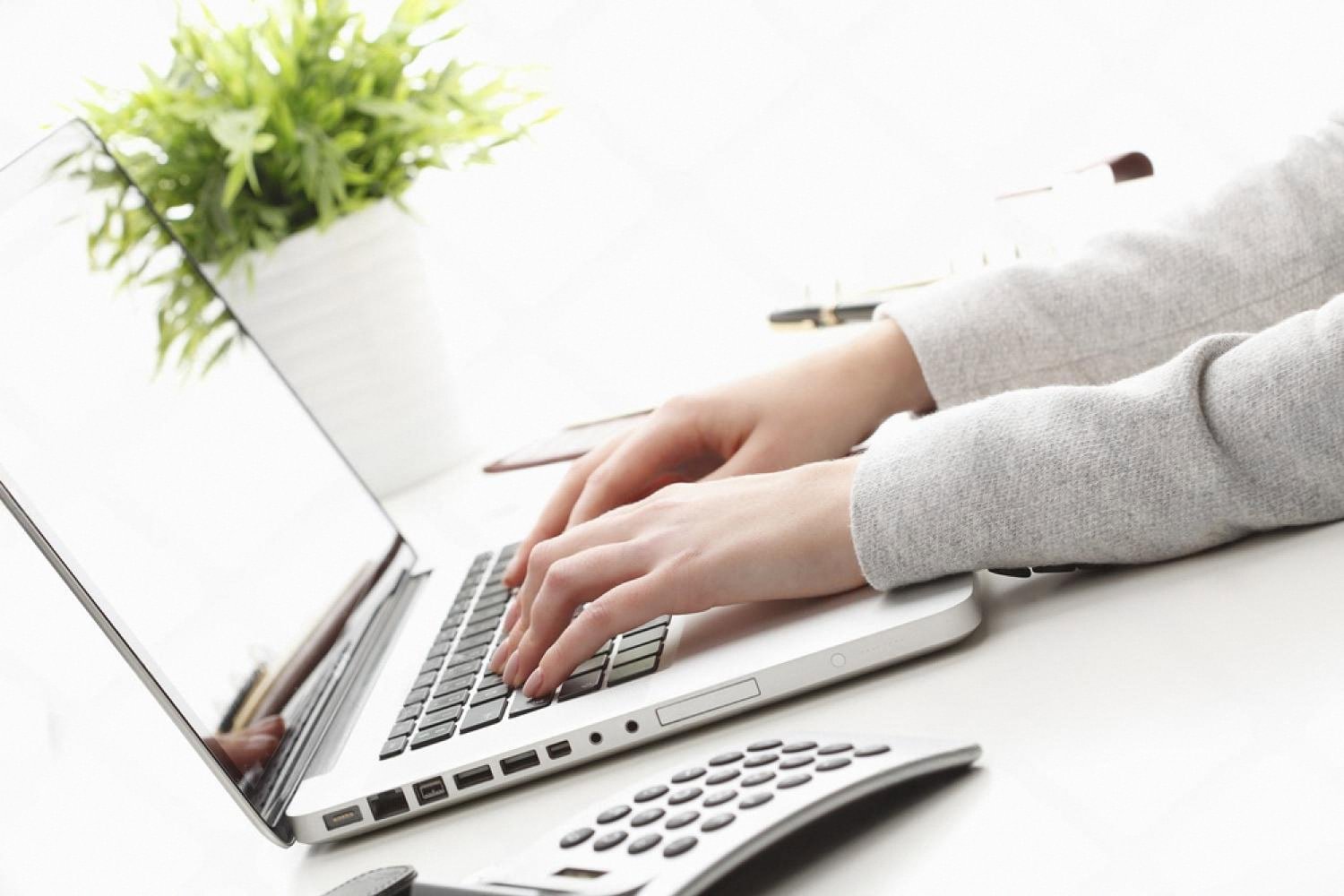 Rental business owner working on a laptop optimising a Google listing in Dubai